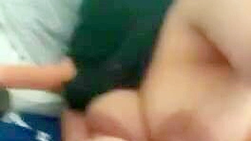 Arab mom in hijab displays on camera saggy boobs with big XXX nipples