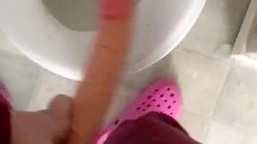 Eccentric Iranian mom with camera in hand brings XXX dildo into toilet