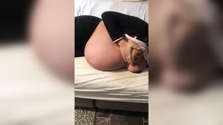 Pregnant Iraqi mom lies on the bed and teases with her XXX breasts