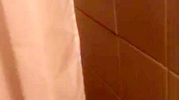 Lecherous Arab mom is captured naked in shower by the XXX cameraman