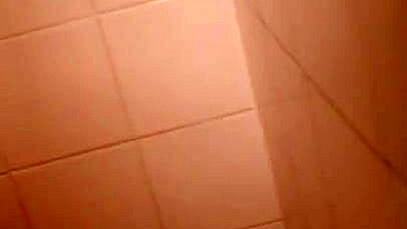 Lecherous Arab mom is captured naked in shower by the XXX cameraman