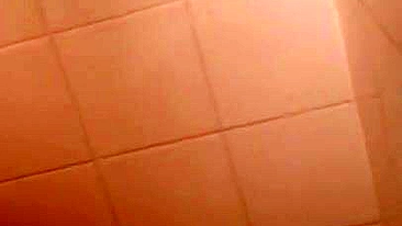 Lecherous Arab mom is captured naked in shower by the XXX cameraman