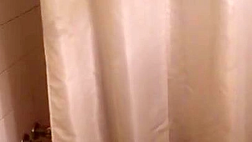 Lecherous Arab mom is captured naked in shower by the XXX cameraman