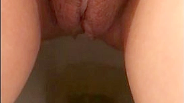 Arab mom captures unshaved muff as she pisses in the solo XXX video