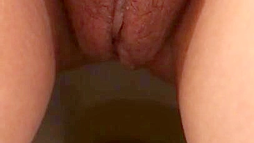 Arab mom captures unshaved muff as she pisses in the solo XXX video