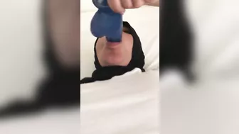 Blue XXX toy is inside mouth of Dubai mom in white top and colorful pants