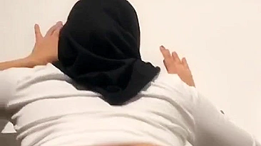 Stacked mom in hijab and tight pants moves her XXX shaped ass on camera