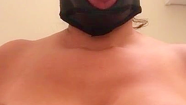 Arab mom with XXX mask on face sticks tongue out asking for some sperm