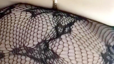 Pervert Arab mom in fishnet nightgown touches her XXX sized boobies