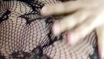 Pervert Arab mom in fishnet nightgown touches her XXX sized boobies