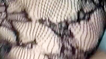 Pervert Arab mom in fishnet nightgown touches her XXX sized boobies