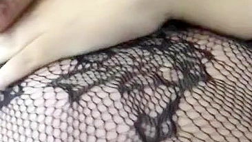 Pervert Arab mom in fishnet nightgown touches her XXX sized boobies