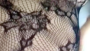 Pervert Arab mom in fishnet nightgown touches her XXX sized boobies