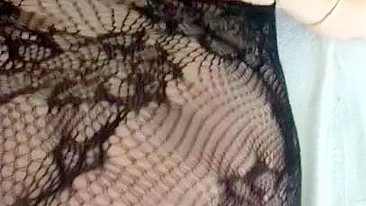 Pervert Arab mom in fishnet nightgown touches her XXX sized boobies