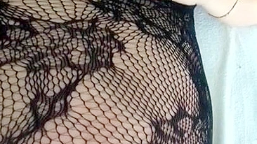 Pervert Arab mom in fishnet nightgown touches her XXX sized boobies