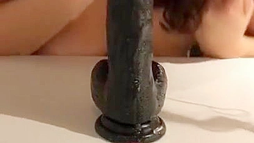 Irani mom has oral XXX sex with big black sex toy stuck to a table
