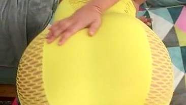 Algerian mom pulls tight yellow dress up a bit to expose XXX shaped ass