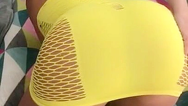 Algerian mom pulls tight yellow dress up a bit to expose XXX shaped ass