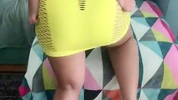 Algerian mom pulls tight yellow dress up a bit to expose XXX shaped ass