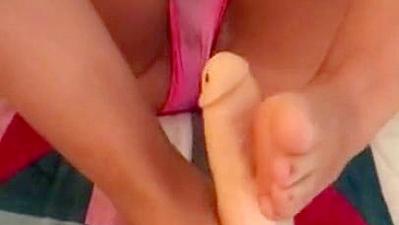 Super-hot Arab mom in pink panties gives a XXX footjob to a big sex toy