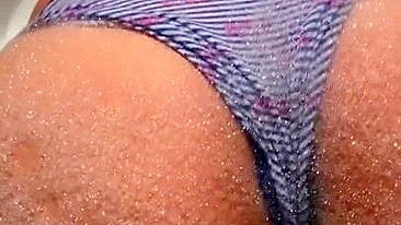 Arab mom in striped panties washes XXX shaped rear in the soapy water