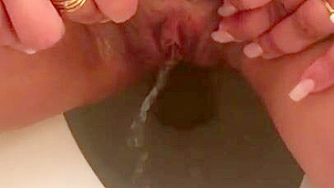 Naked Arab mom in hijab pisses missing toilet in fetish XXX porn close-up