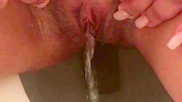 Naked Arab mom in hijab pisses missing toilet in fetish XXX porn close-up