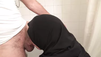 Obedient Arab mom in hijab gags on the huge pecker in the bathroom