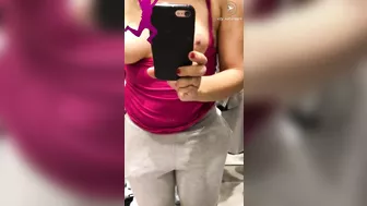 Shameless Arab mom shows and records her tits in the changing booth