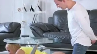 Blonde mom decides to be drilled by son as she is stuck under table