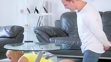 Blonde mom decides to be drilled by son as she is stuck under table