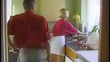 Stepson secretly bangs and facializes short-haired mom in kitchen