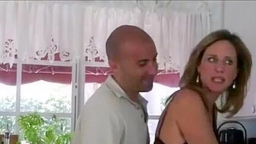 Bald stud sneakily and passionately fucks classy mom in kitchen