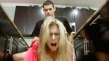 Blonde mom with glasses sneakily banged by stepson in the kitchen