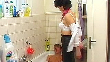 Slim brunette mom banged by stepson after washing his dick in bath
