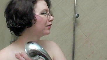 Stepson joins nerdy mom in the shower and taste her moist snatch