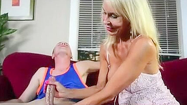 Young man cums in just ten minutes as mom gives him a XXX handjob