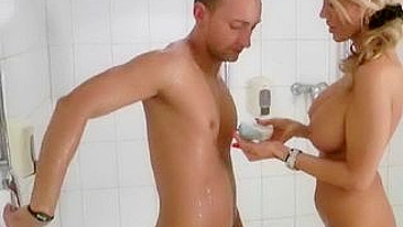 Blonde mom gives a XXX handjob to her excited stepson in the shower