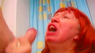 Red-haired mom rewarded with XXX facial after sex with boy in bath
