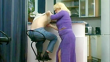 Relaxed guy seduced by mature blond mom who whips out her XXX jugs