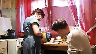 Depressed boy and short-haired mature mom make XXX love in kitchen