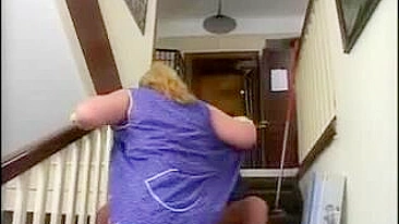 Chubby mom interrupts cleaning to have XXX fun with errand boy on stairs
