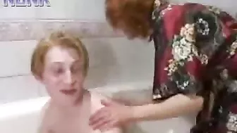 Caring mom bathes teen stepson paying special attention to XXX cock