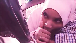 Lecherous Arab mom in white hijab sucks her man's cock in the car