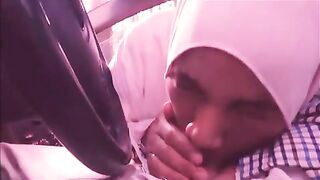 Lecherous Arab mom in white hijab sucks her man's cock in the car