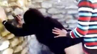 Horny Arab stud fucks amateur mom in hijab against the wall outdoors