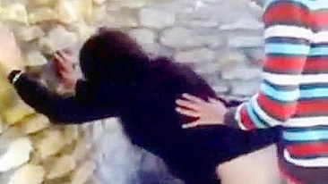 Horny Arab stud fucks amateur mom in hijab against the wall outdoors