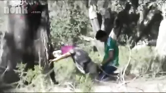 Dressed Arab mom bends by the tree to get fucked hard in the woods