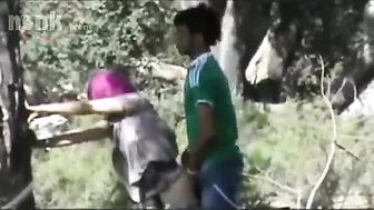 Dressed Arab mom bends by the tree to get fucked hard in the woods