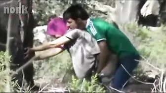 Dressed Arab mom bends by the tree to get fucked hard in the woods